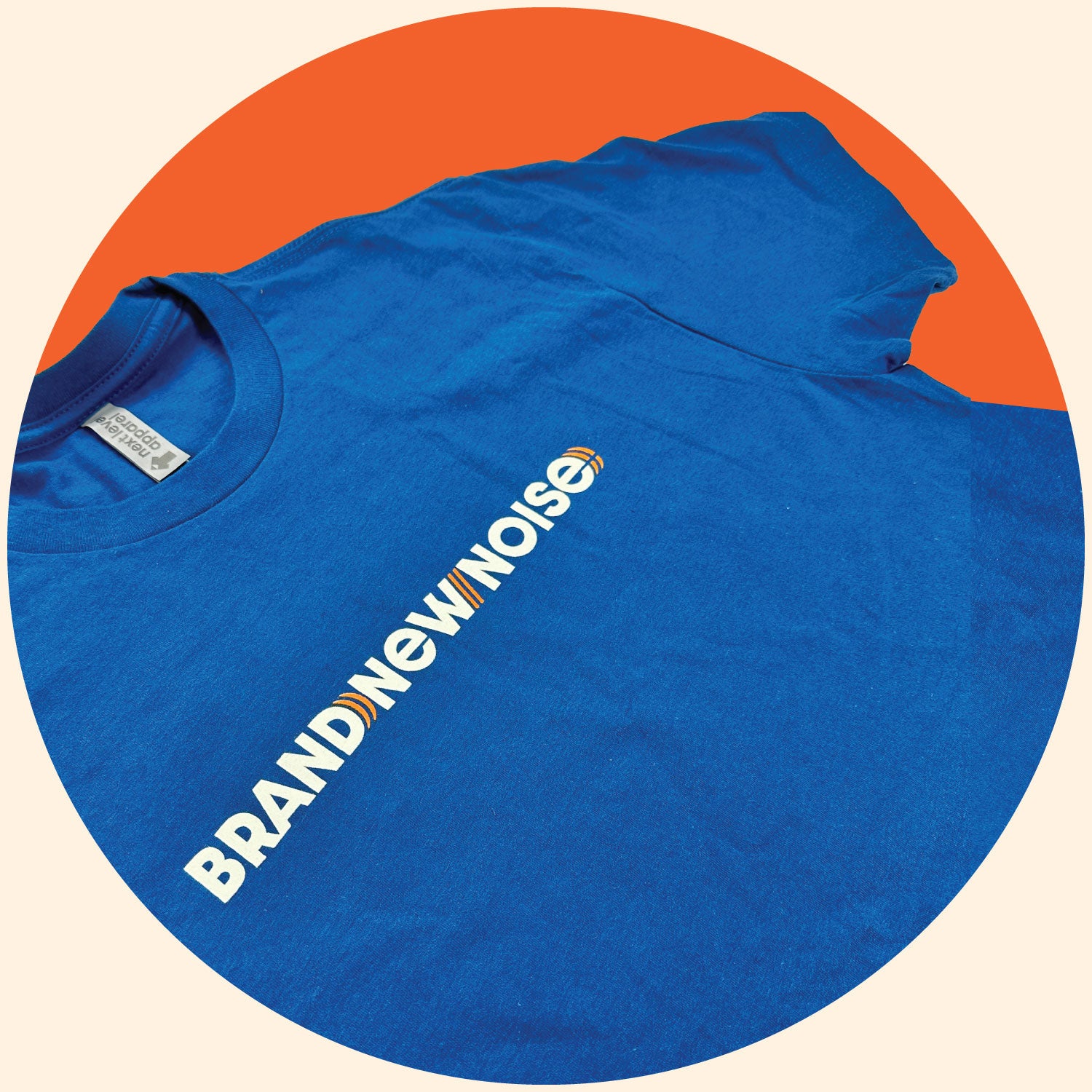 close up of  BrandNewNOise logo on blue short sleeve t-shirt